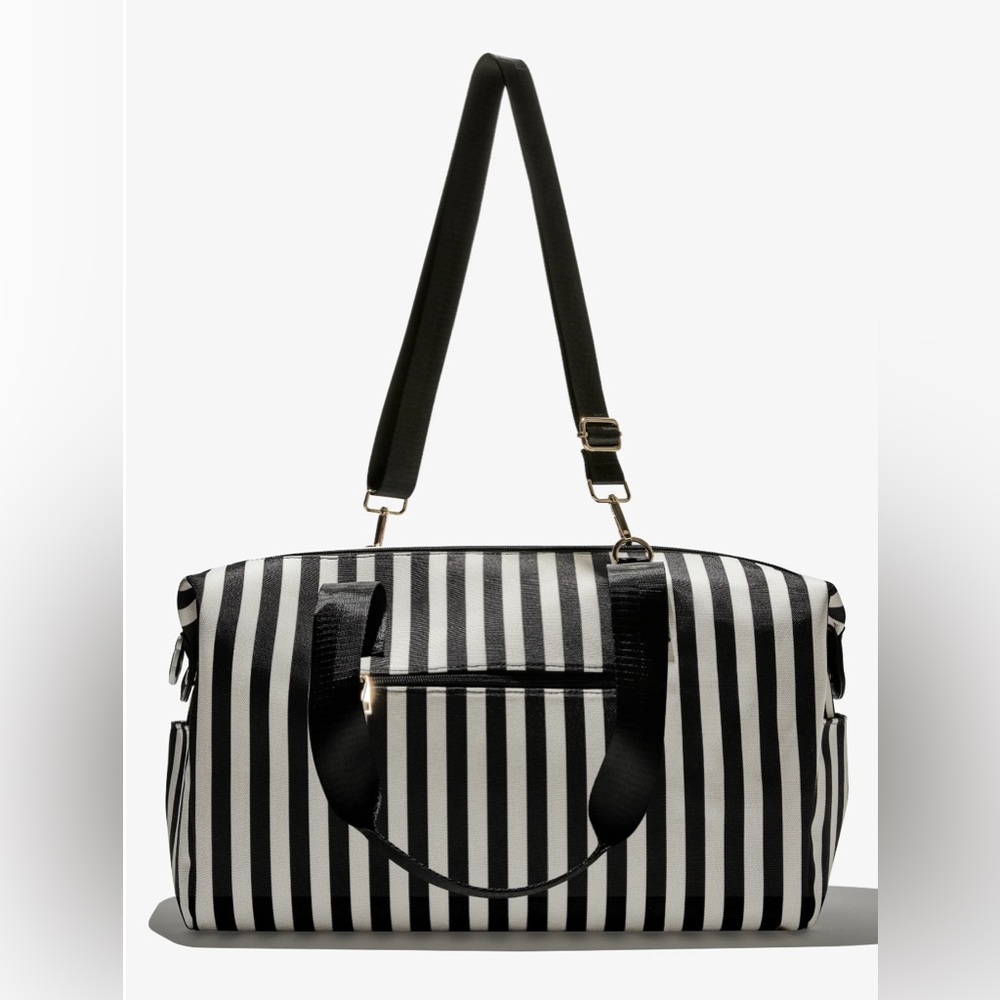 Used but looks new.   Alice & Olivia Duffle Bag